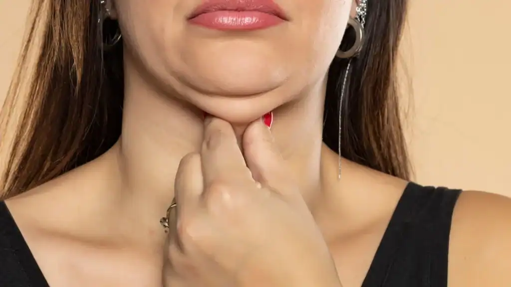 An image of a woman with double chin, sad, worried : Non Surgical Double Chin Removal Treatment in Midhurst, UK